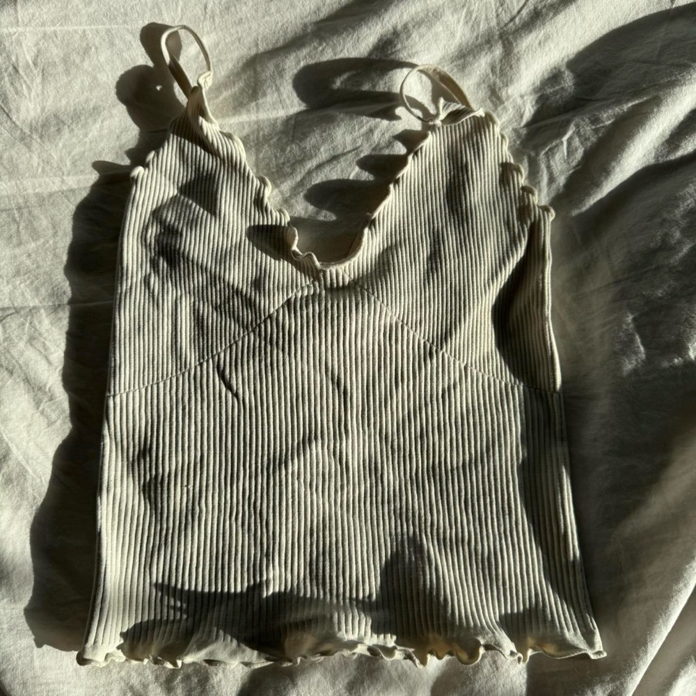 Cream Ribbed Ruffled Camisole with Scoop Neck and Sleeveless Design